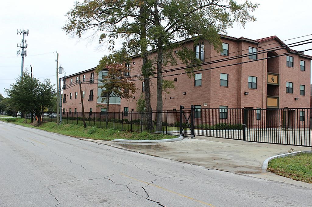 10102 Neuens Road, Unit A302 Houston, TX 77080 - Photo 8 of 8 a view of a street with brick walls