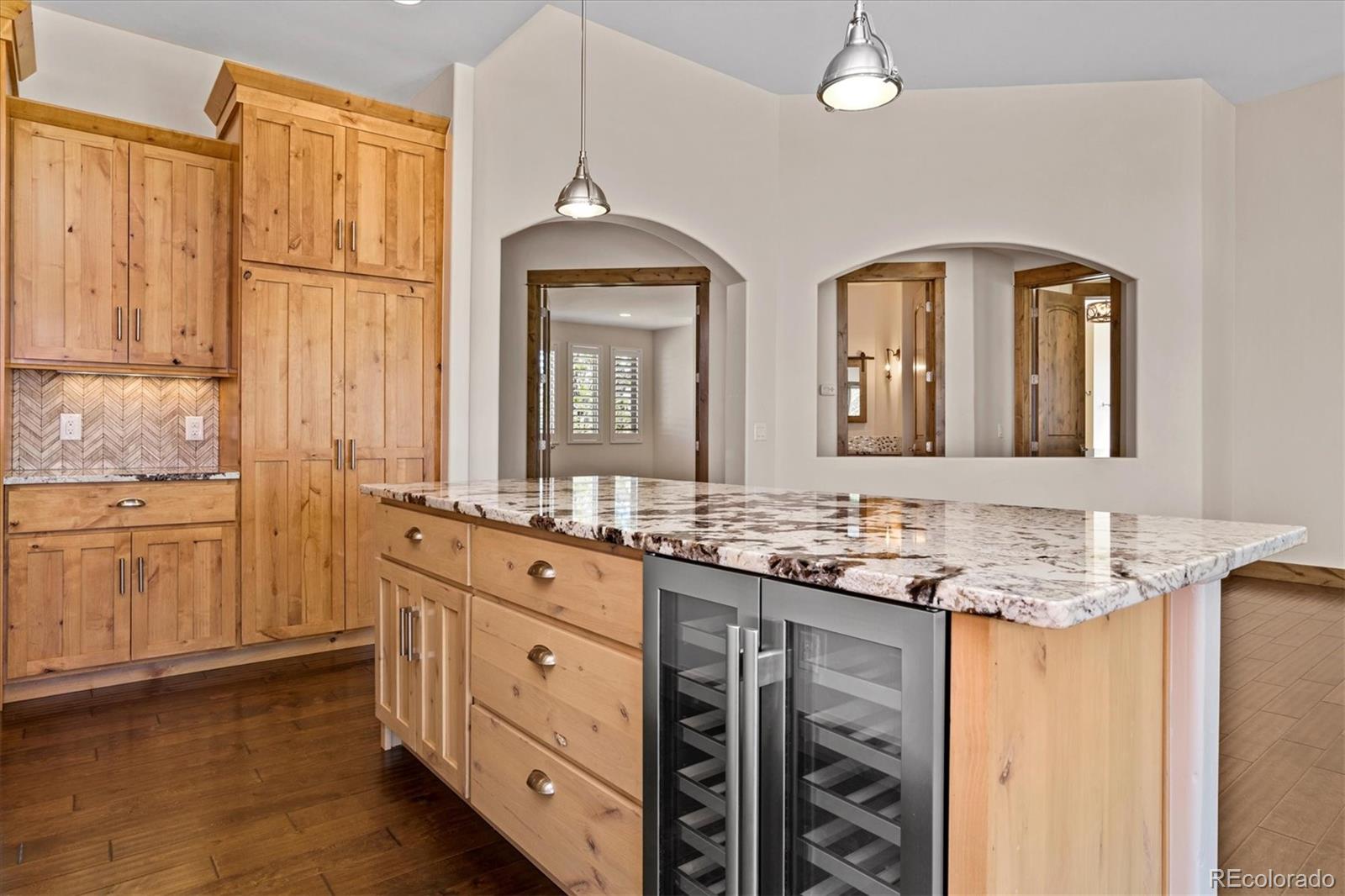 5561 Rim View Place Parker, CO 80134 - Photo 15 of 40 a bathroom with a granite countertop sink and a mirror