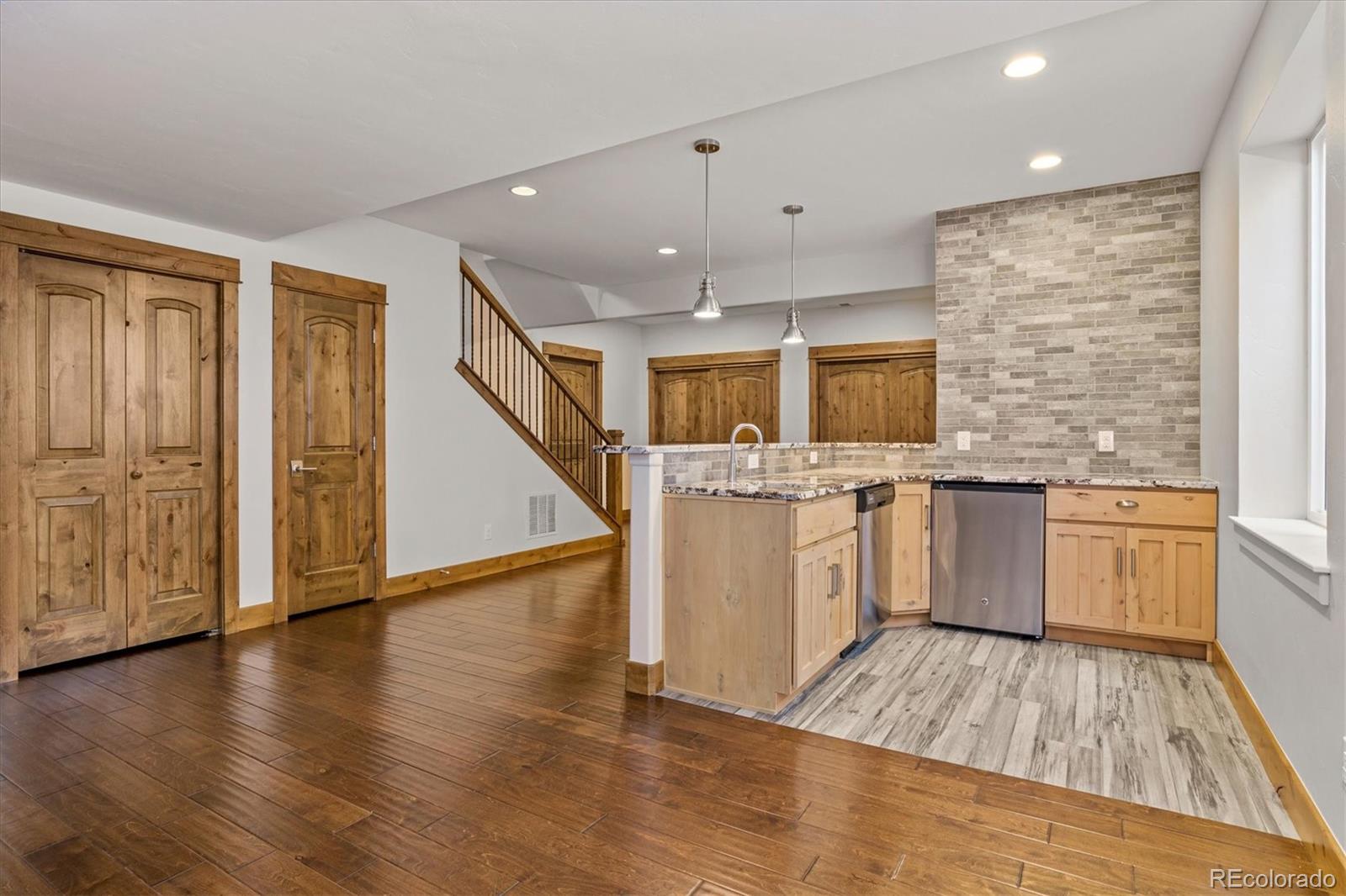 5561 Rim View Place Parker, CO 80134 - Photo 26 of 40 a large kitchen with a large counter top appliances and cabinets