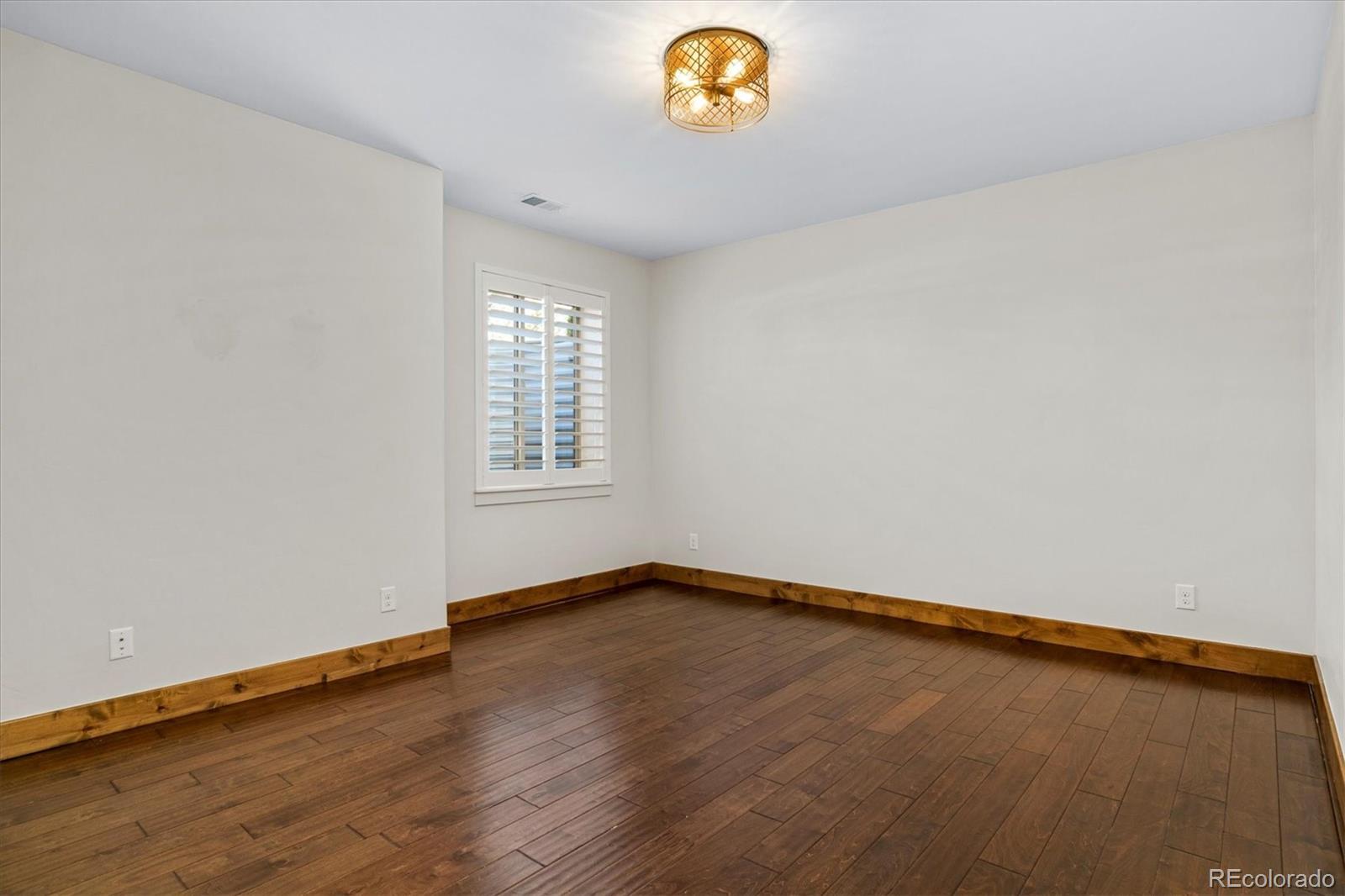 5561 Rim View Place Parker, CO 80134 - Photo 33 of 40 an empty room with window