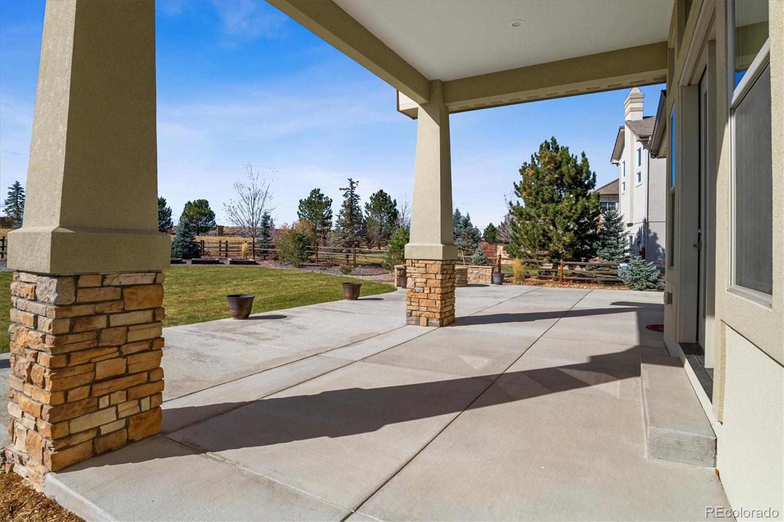 5561 Rim View Place Parker, CO 80134 - Photo 34 of 40 a view of a building from a street