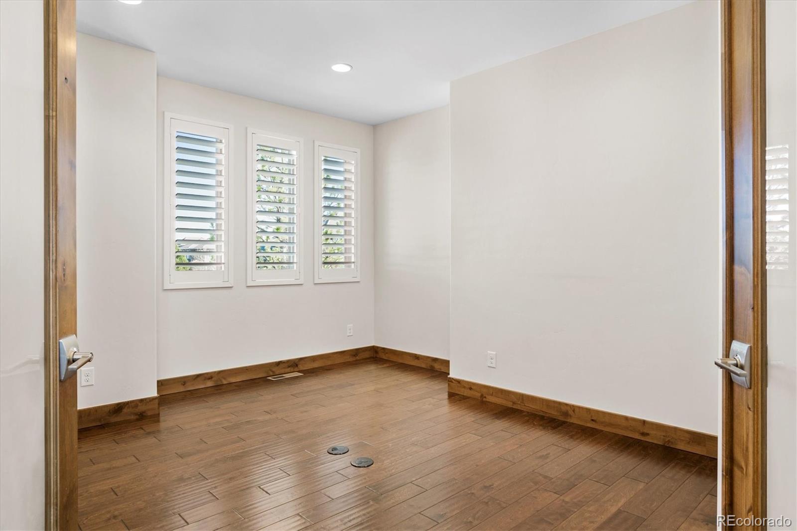 5561 Rim View Place Parker, CO 80134 - Photo 5 of 40 an empty room with a window