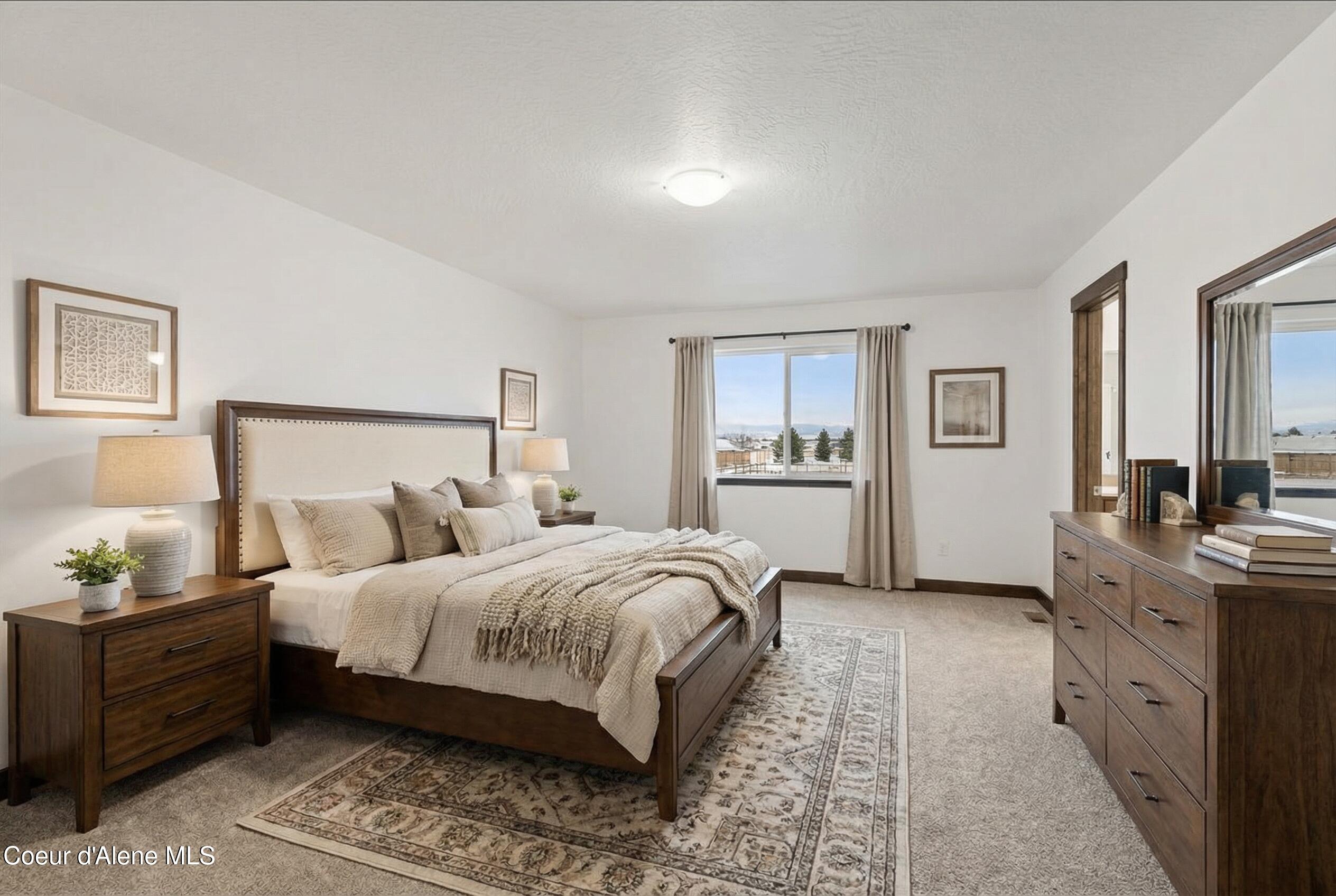 2902 North Neptune Street Post Falls, ID 83854 - Photo 19 of 37 Selway primary bedroom staged