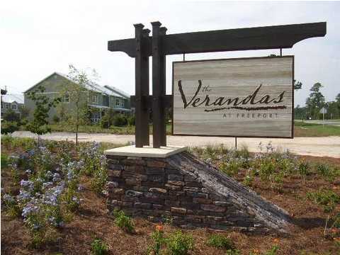 29 South Sand Palm Road, Unit 24 Freeport, FL 32439 - Photo 2 of 17 a view of outdoor space with sign board