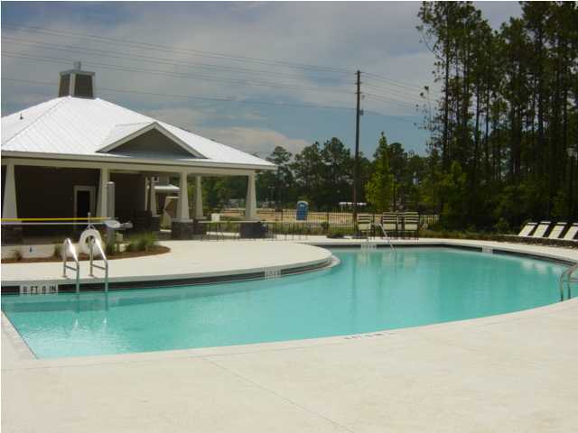 29 South Sand Palm Road, Unit 24 Freeport, FL 32439 - Photo 15 of 17 a view of a house with swimming pool