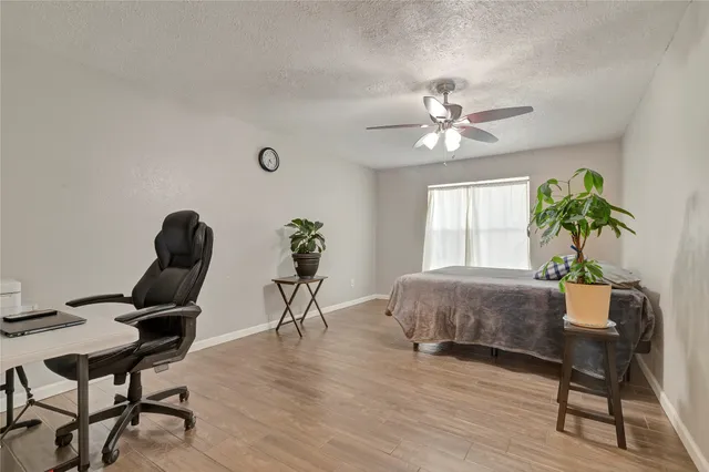 a workspace with furniture and a chandelier