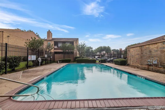 a view of a swimming pool with a lounge chairs
