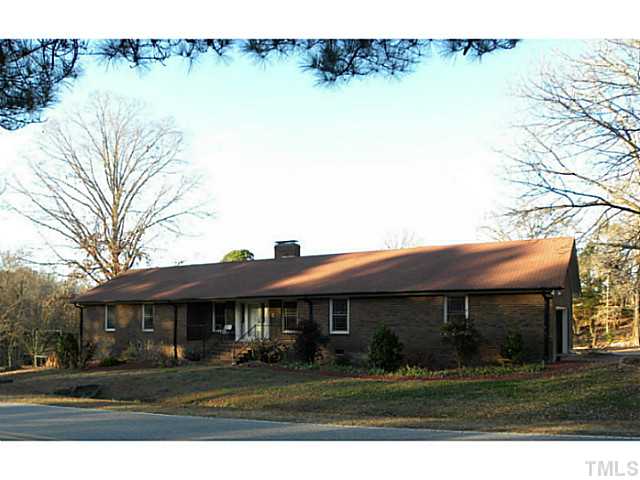750 Greenleaf Road Angier, NC 27501 - Photo 1 of 10 a front view of a house with garden