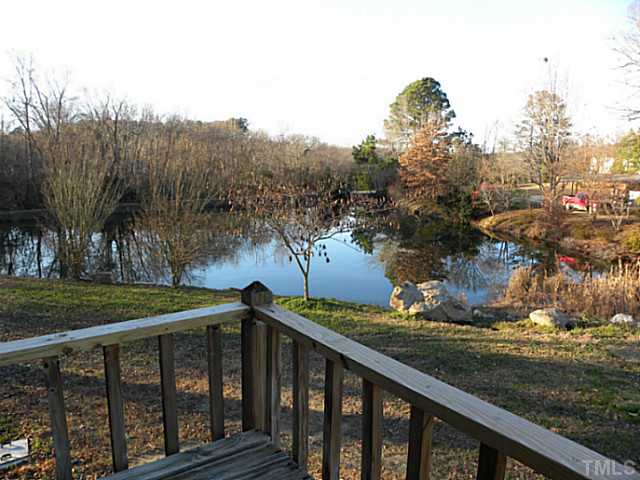 750 Greenleaf Road Angier, NC 27501 - Photo 2 of 10 a view of a wooden deck and a yard