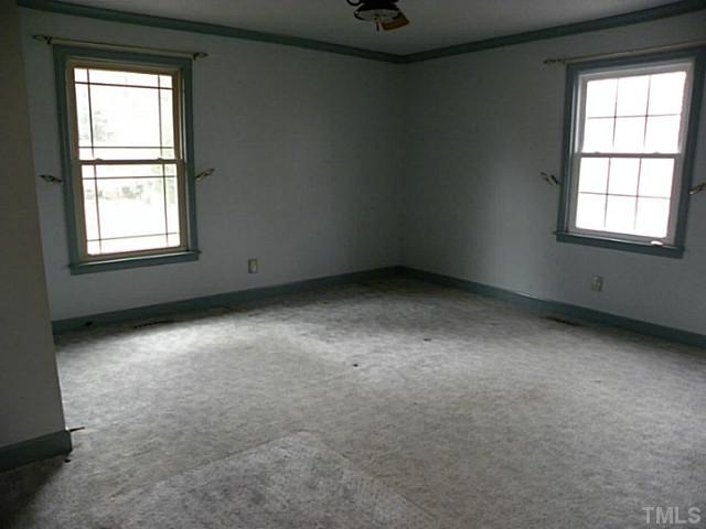 750 Greenleaf Road Angier, NC 27501 - Photo 8 of 10 an empty room with a window