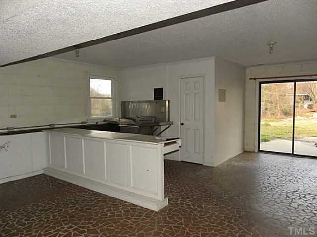 750 Greenleaf Road Angier, NC 27501 - Photo 10 of 10 a kitchen with stainless steel appliances granite countertop a refrigerator and a sink