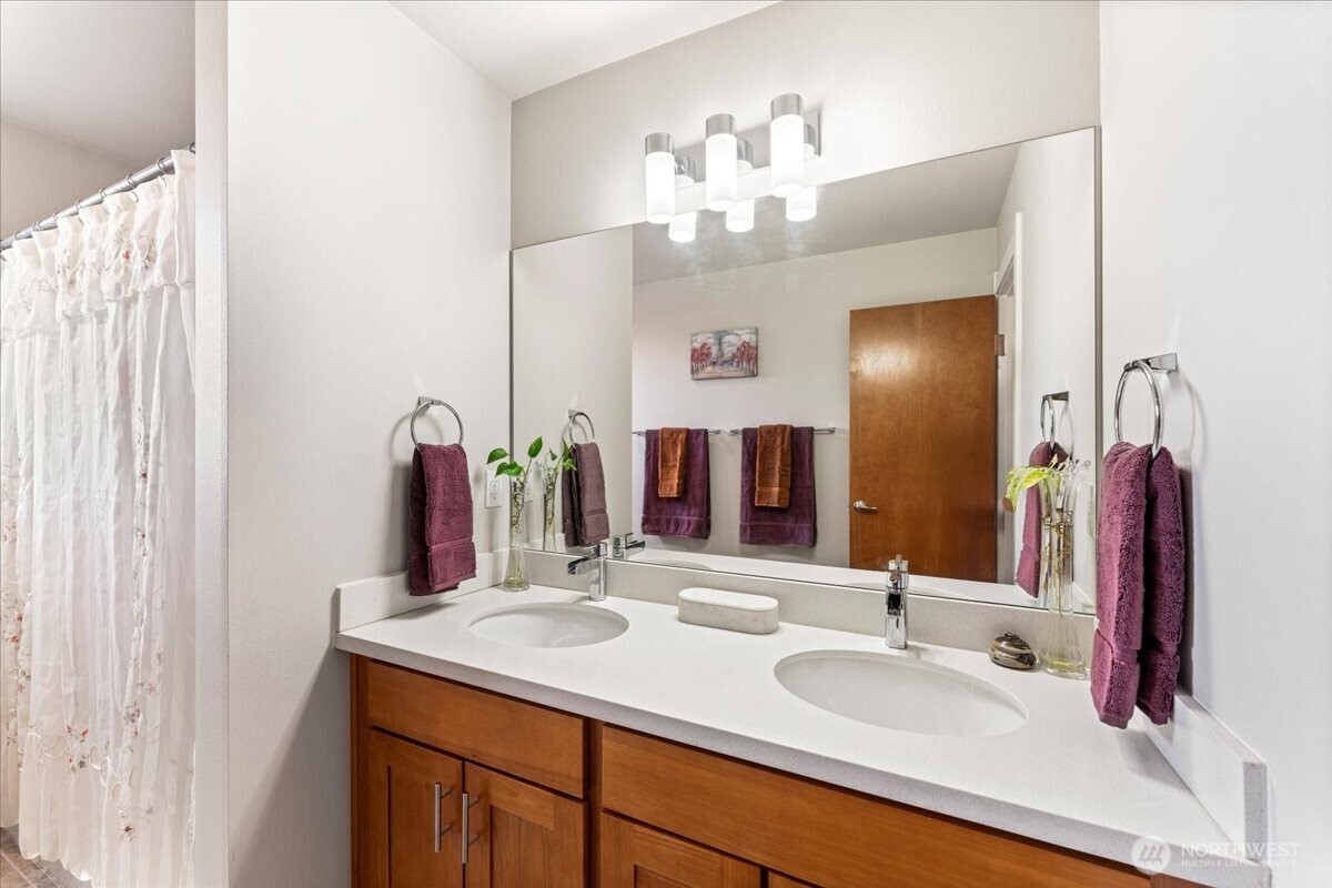 12418 2nd Place Southwest Burien, WA 98146 - Photo 19 of 39 a bathroom with a double vanity sink and a mirror