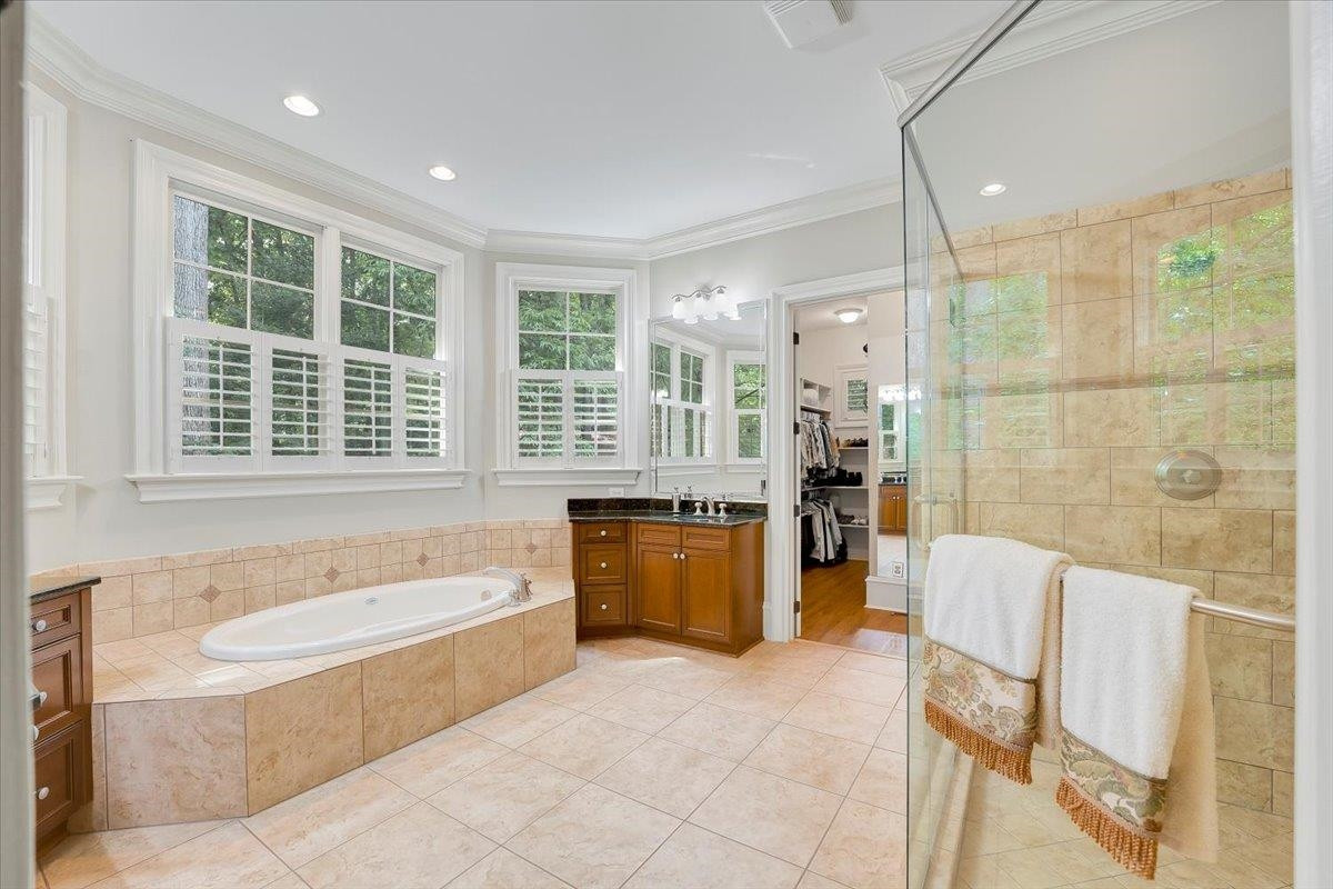 9712 Honeycutt Road Raleigh, NC 27614 - Photo 23 of 83 Spacious with Two Vanities, Spa Soaking Tub and Separate Shower. Owner's Spa Bath