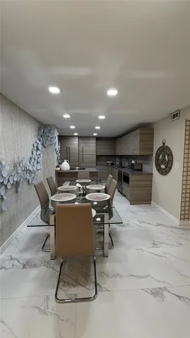 a view of a dining room with furniture