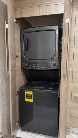 a utility room with washer and dryer