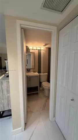 a en suite bathroom with a sink and mirror