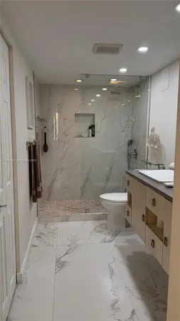 a bathroom with a sink and mirror