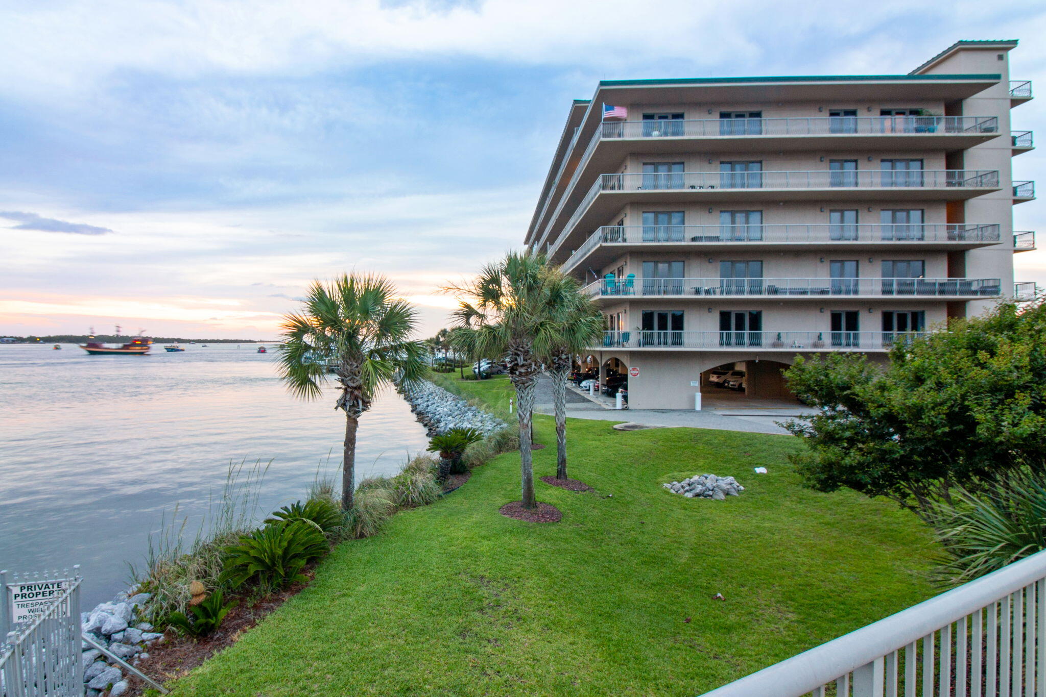 5 Calhoun Avenue, Unit 606 Destin, FL 32541 - Photo 1 of 37 a view of a lake with a building in the background