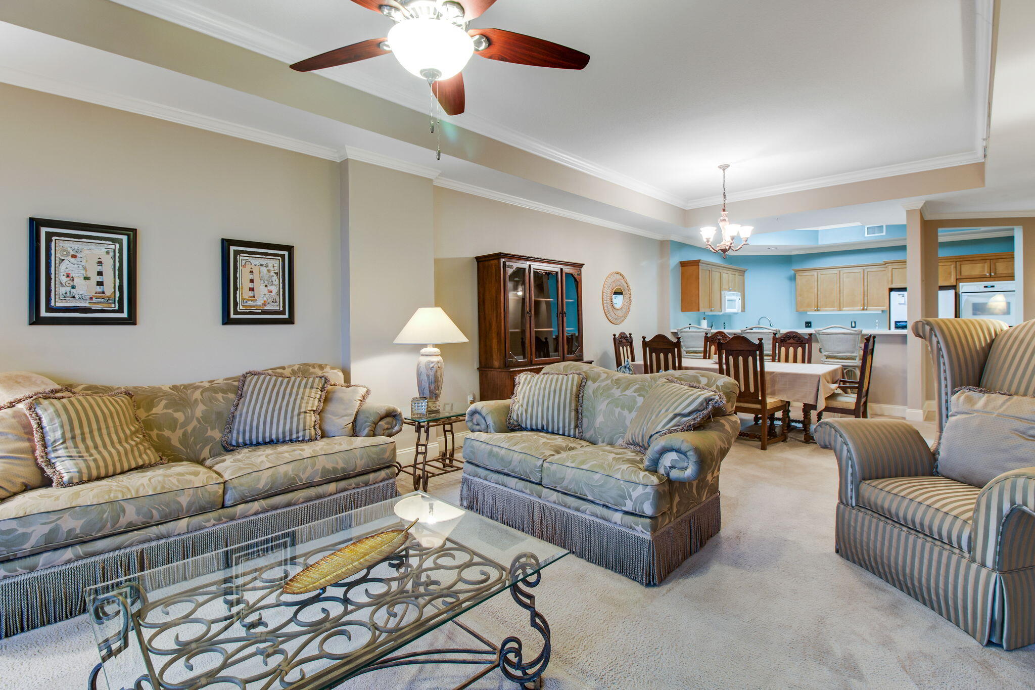 5 Calhoun Avenue, Unit 606 Destin, FL 32541 - Photo 16 of 37 a living room with furniture and a chandelier