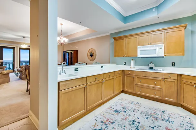 a view of a kitchen center island cabinets and living room
