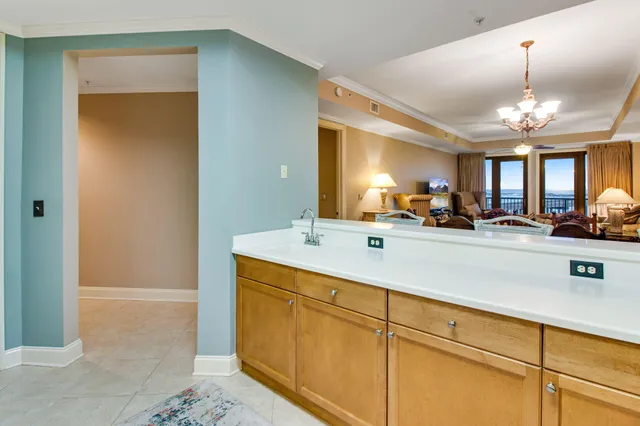 a kitchen with stainless steel appliances granite countertop a refrigerator sink and cabinets