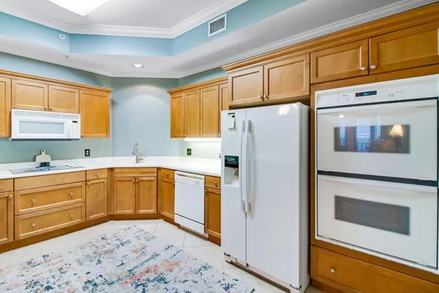 a bathroom with a sink a light fixture and a mirror