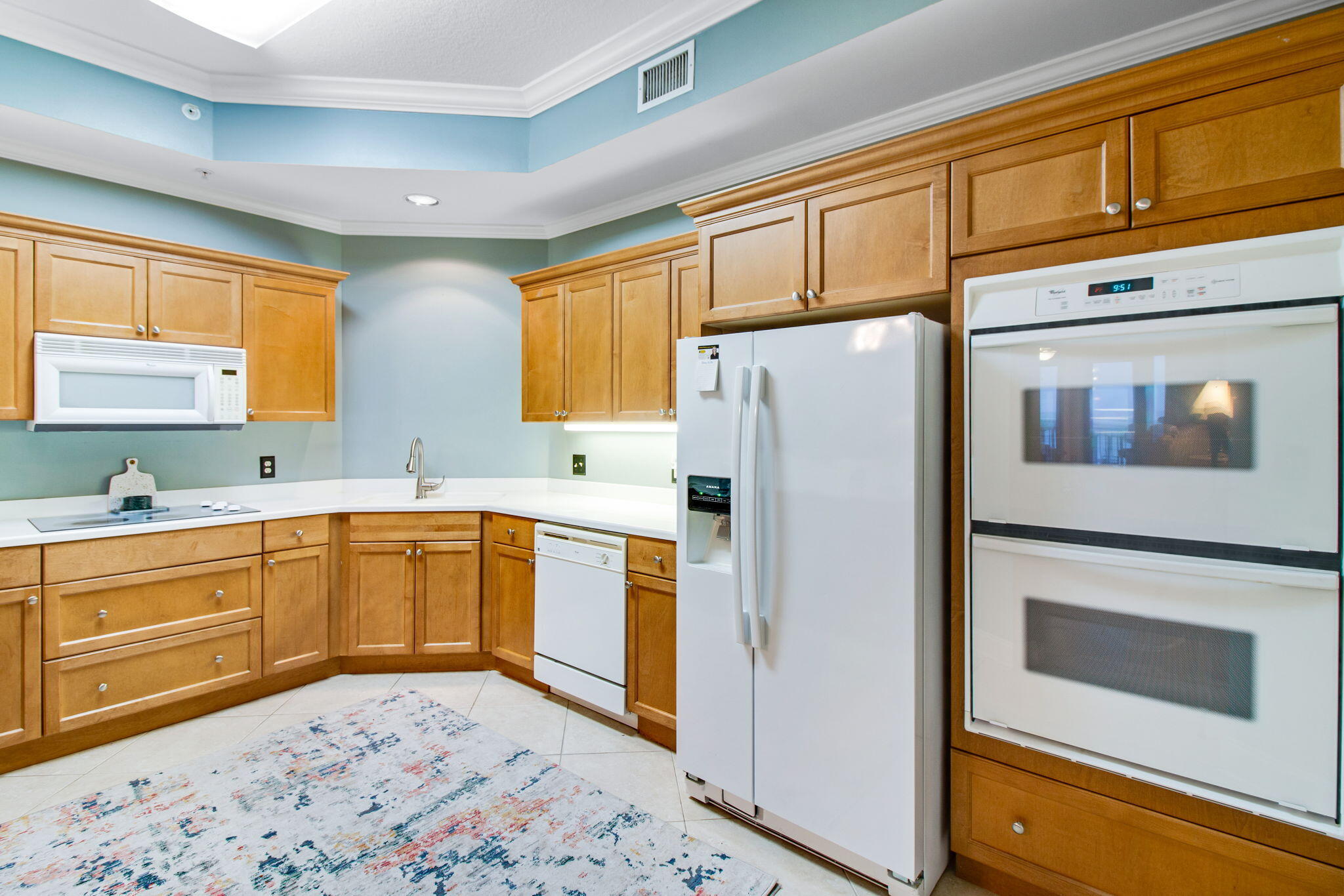 5 Calhoun Avenue, Unit 606 Destin, FL 32541 - Photo 23 of 37 a kitchen with stainless steel appliances granite countertop a refrigerator sink and cabinets