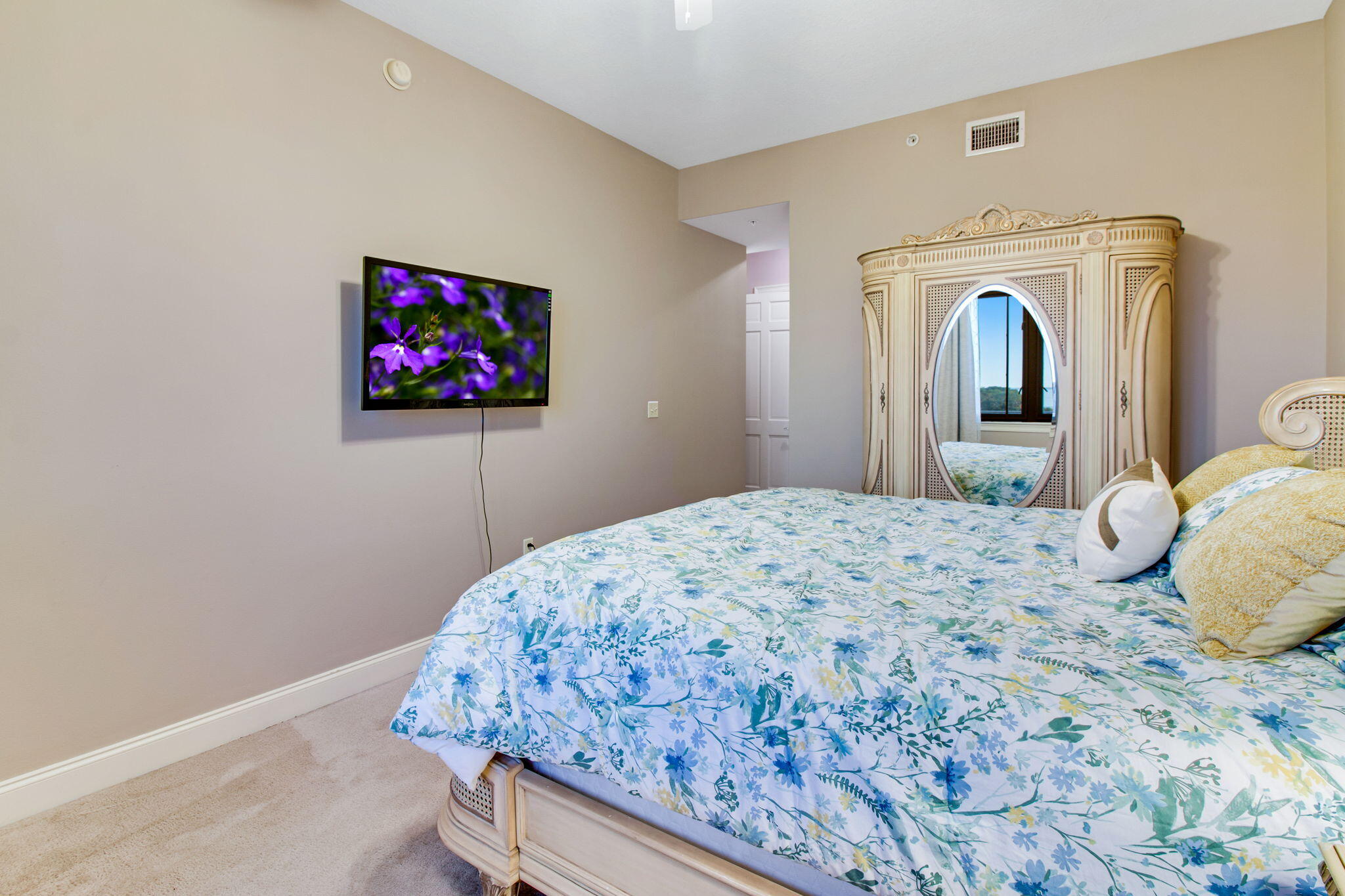 5 Calhoun Avenue, Unit 606 Destin, FL 32541 - Photo 31 of 37 a bedroom with a bed and a flat screen tv