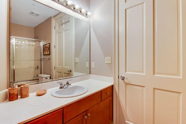 a bathroom with a sink double vanity and a tub