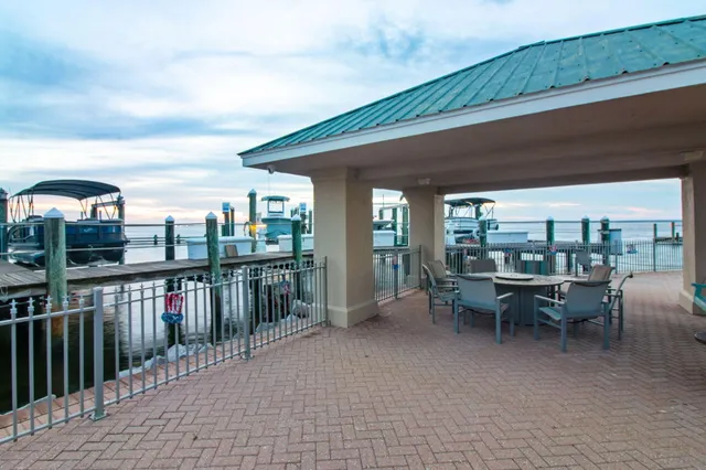 a view of a chairs and table in a balcony