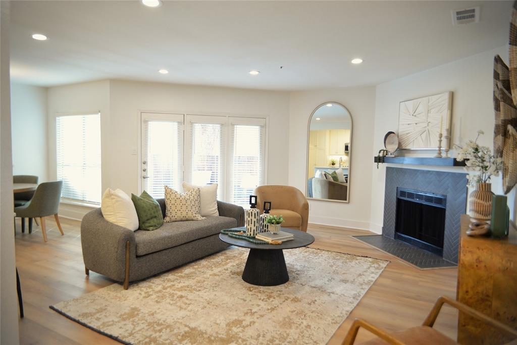 4501 Druid Lane, Unit 124 Dallas, TX 75205 - Photo 2 of 14 a living room with furniture and a fireplace
