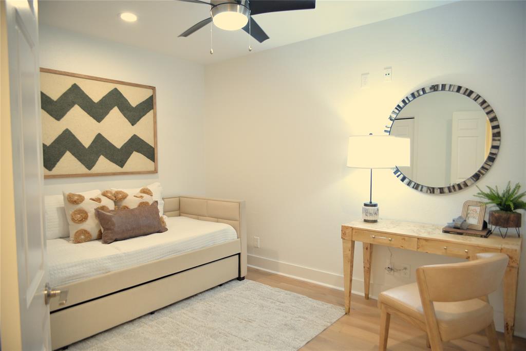 4501 Druid Lane, Unit 124 Dallas, TX 75205 - Photo 8 of 14 a bedroom with a bed and a mirror