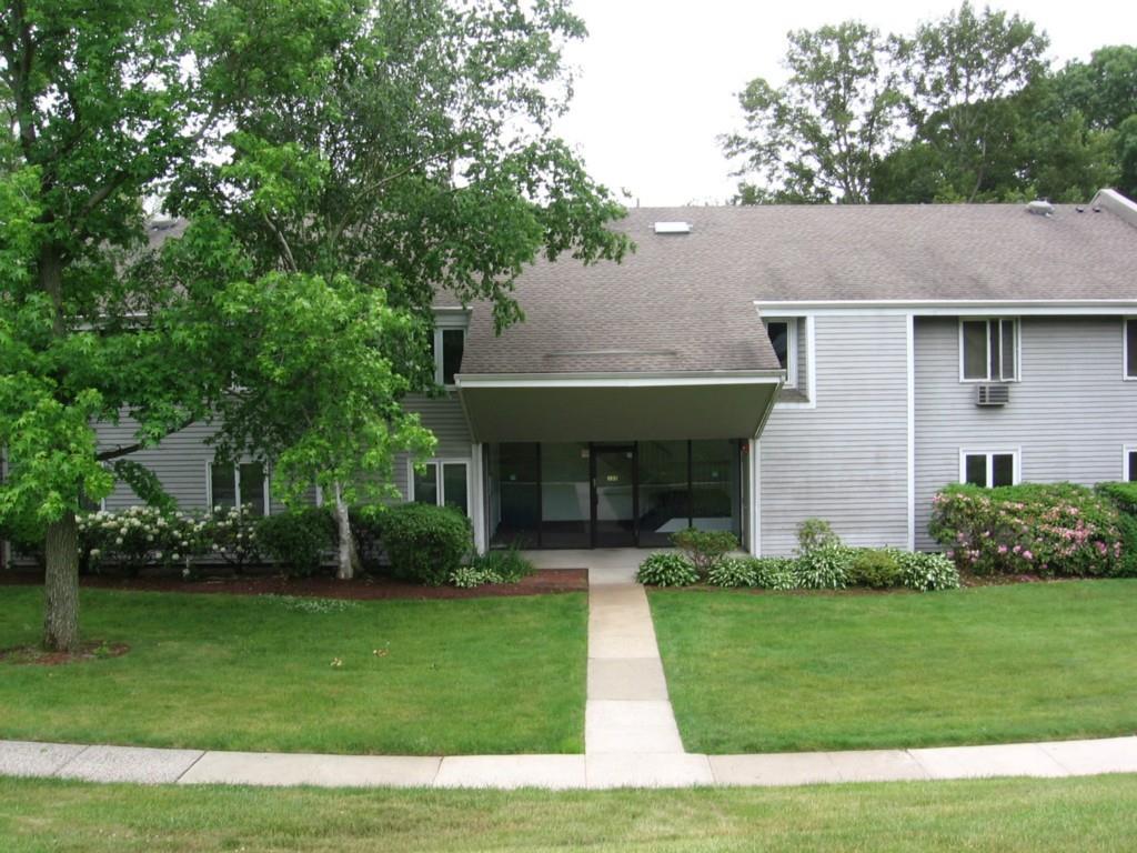135 Florence Road, Unit 2A Branford, CT 06405 - Photo 1 of 1 a front view of a house with a garden and plants