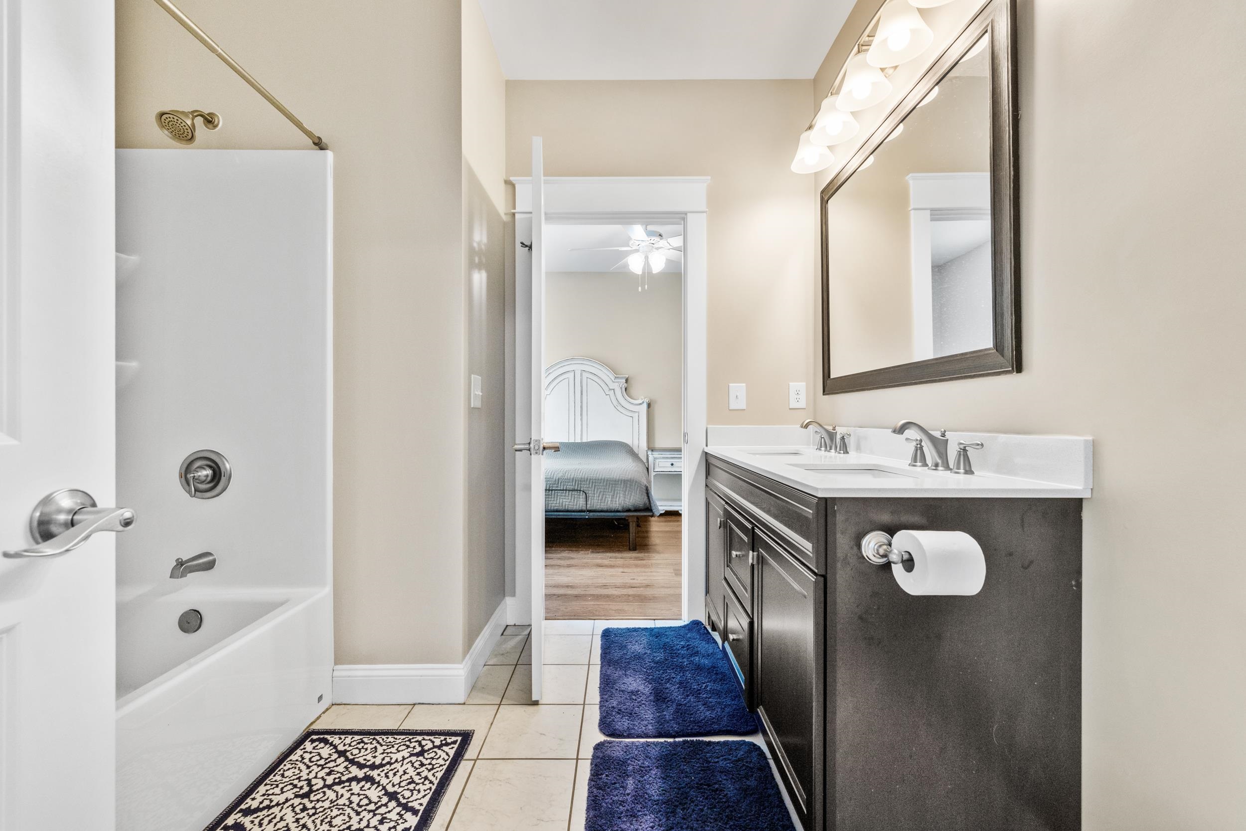 5907 Haskell Circle Myrtle Beach, SC 29577 - Photo 26 of 38 Ensuite bathroom featuring shower / bath combination, double vanity, light tile patterned floors, and ceiling fan