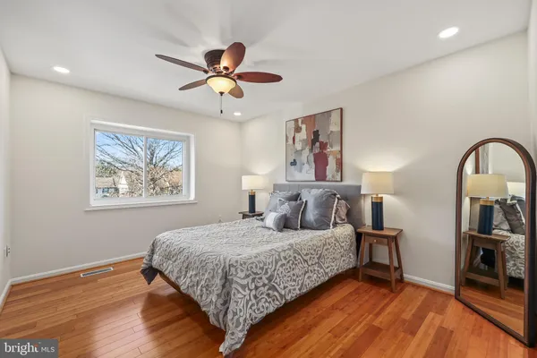 a bedroom with a bed and a view of kitchen