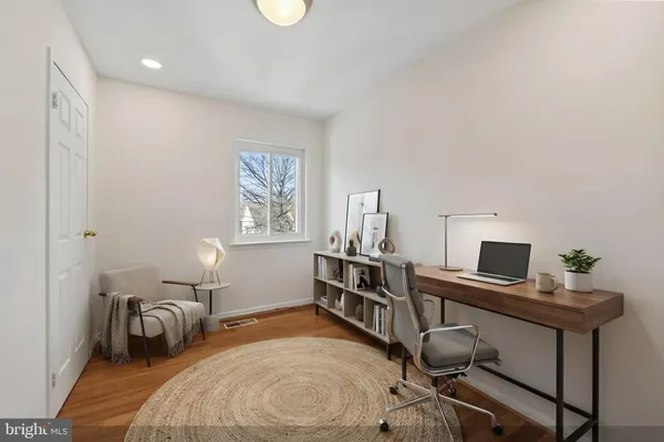 a bedroom with furniture and a window