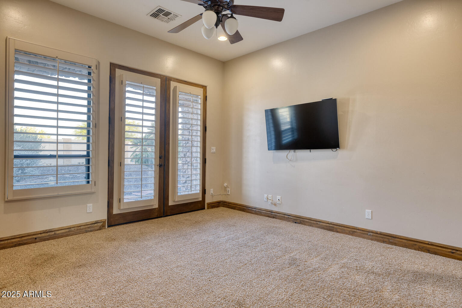 27115 North 137th Street Scottsdale, AZ 85262 - Photo 14 of 24 a view of a livingroom with a flat screen tv