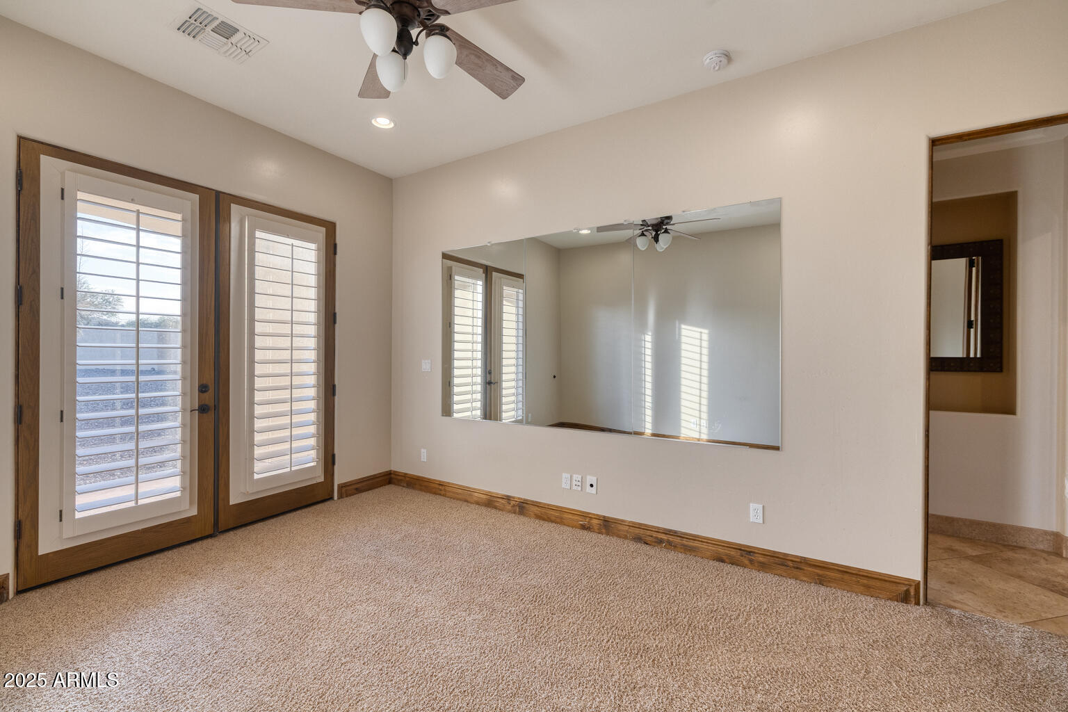 27115 North 137th Street Scottsdale, AZ 85262 - Photo 17 of 24 an empty room with fan and windows