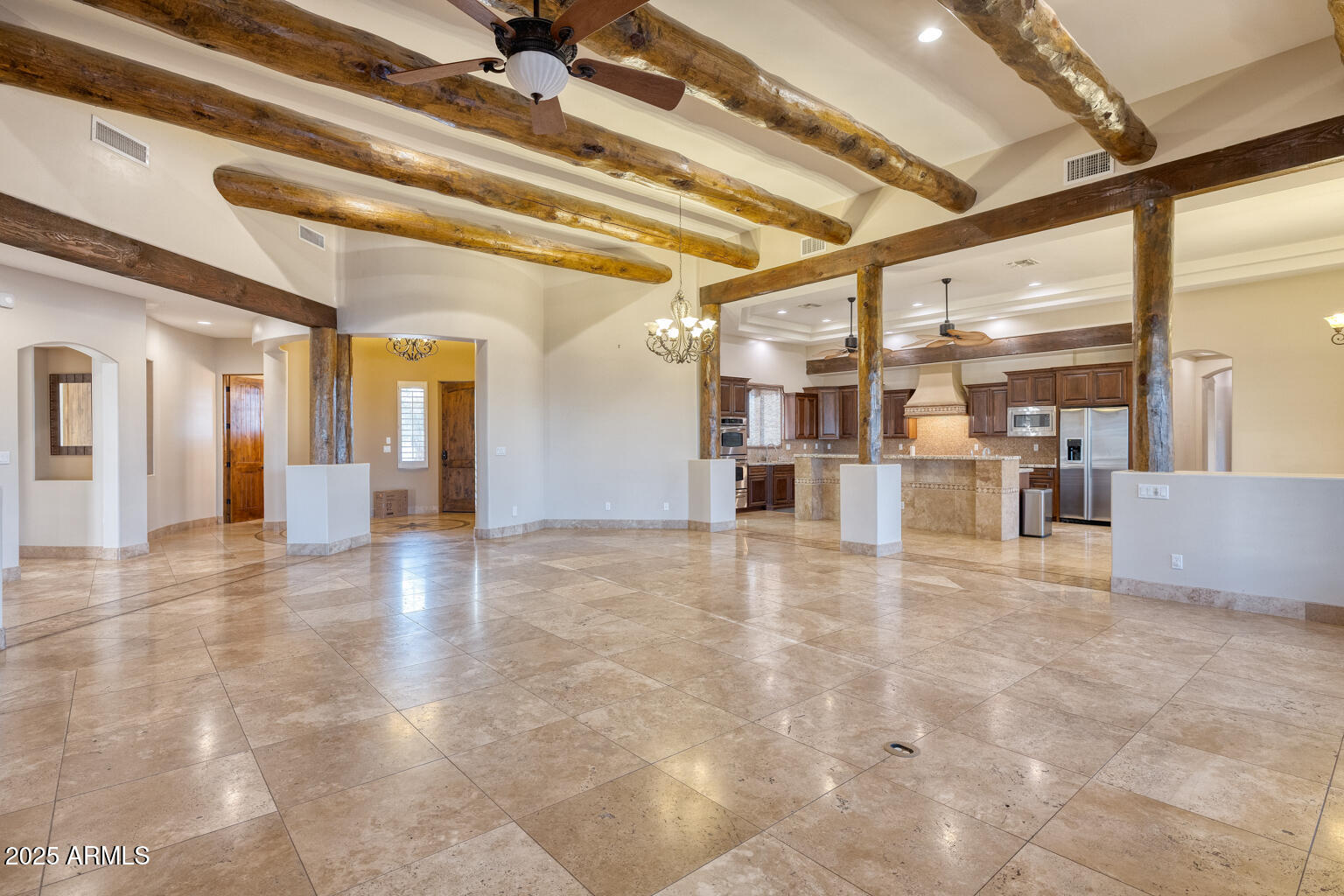 27115 North 137th Street Scottsdale, AZ 85262 - Photo 7 of 24 a view of a hall with a dining table and chairs