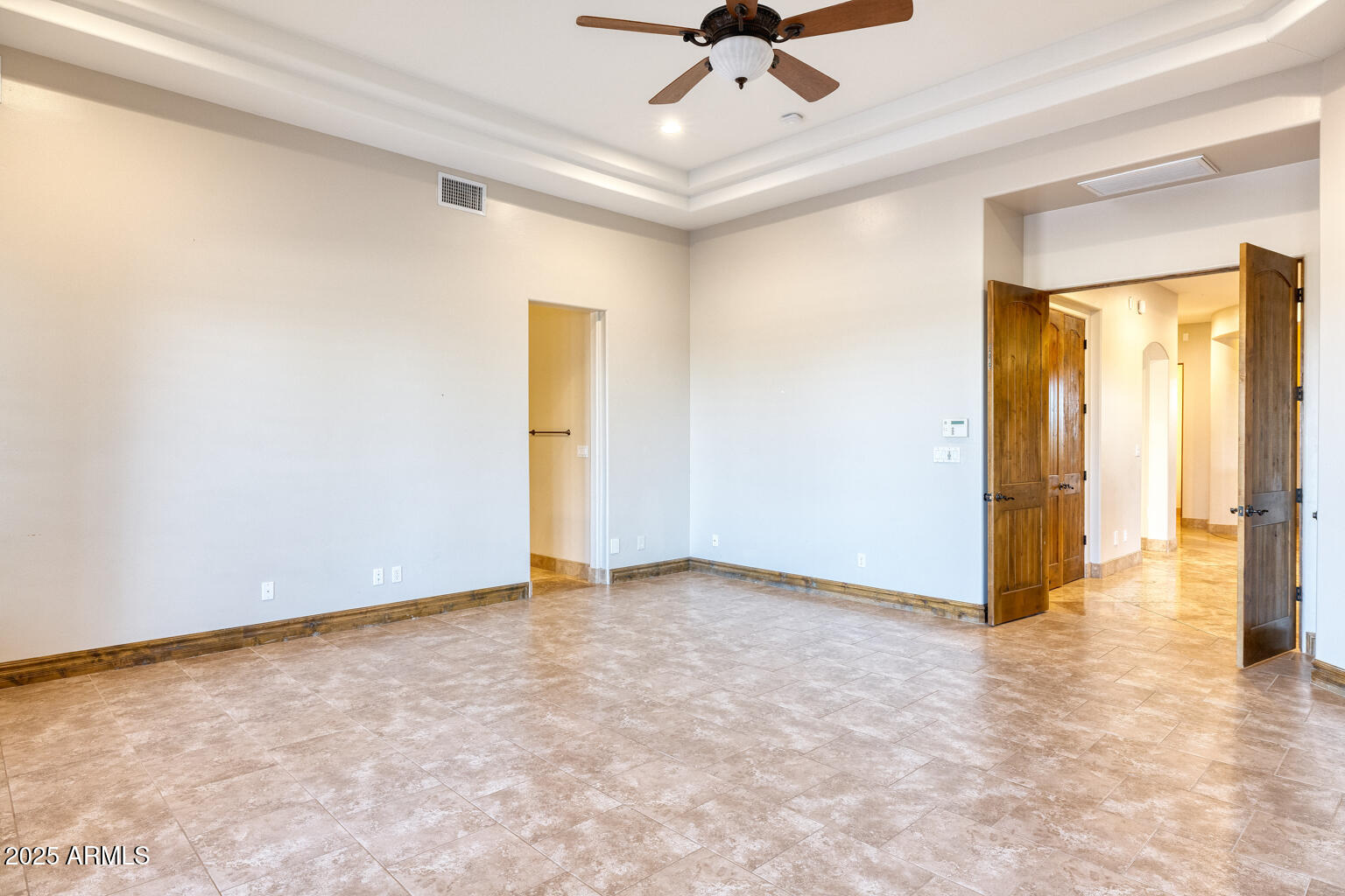 27115 North 137th Street Scottsdale, AZ 85262 - Photo 10 of 24 an empty room with a ceiling fan and carpet