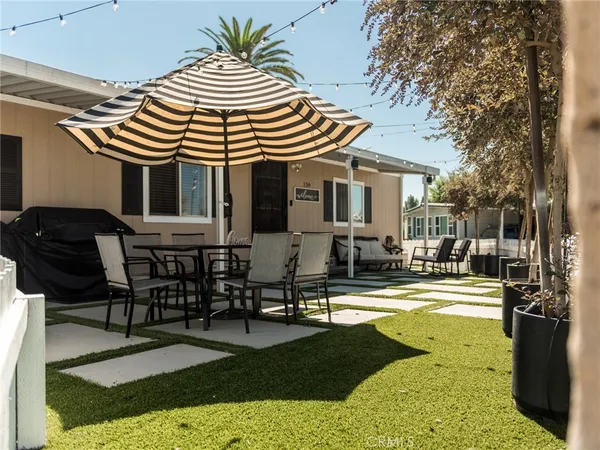 a view of a chair and tables in the patio