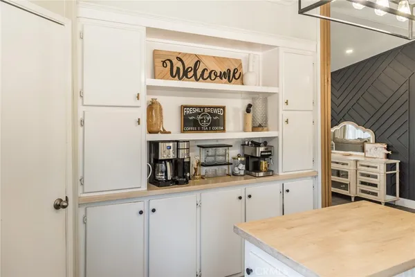 a kitchen with stainless steel appliances a refrigerator and cabinets