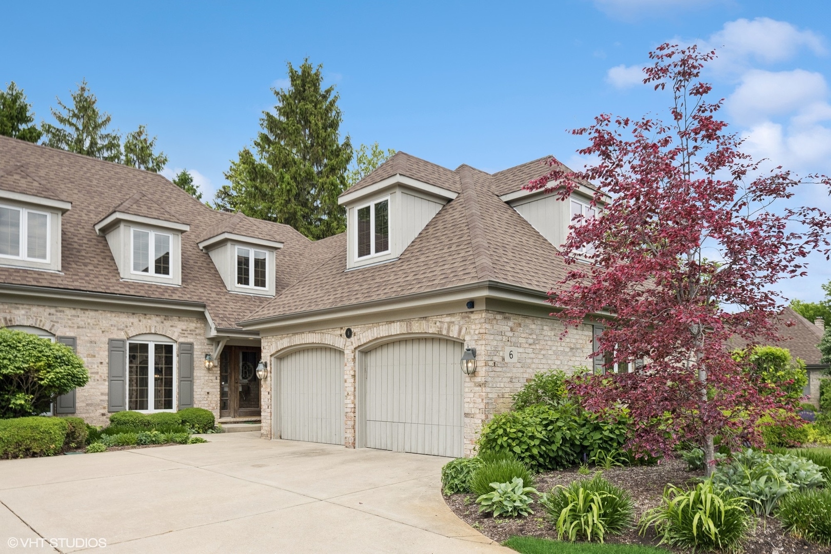 front view of a house with a garden