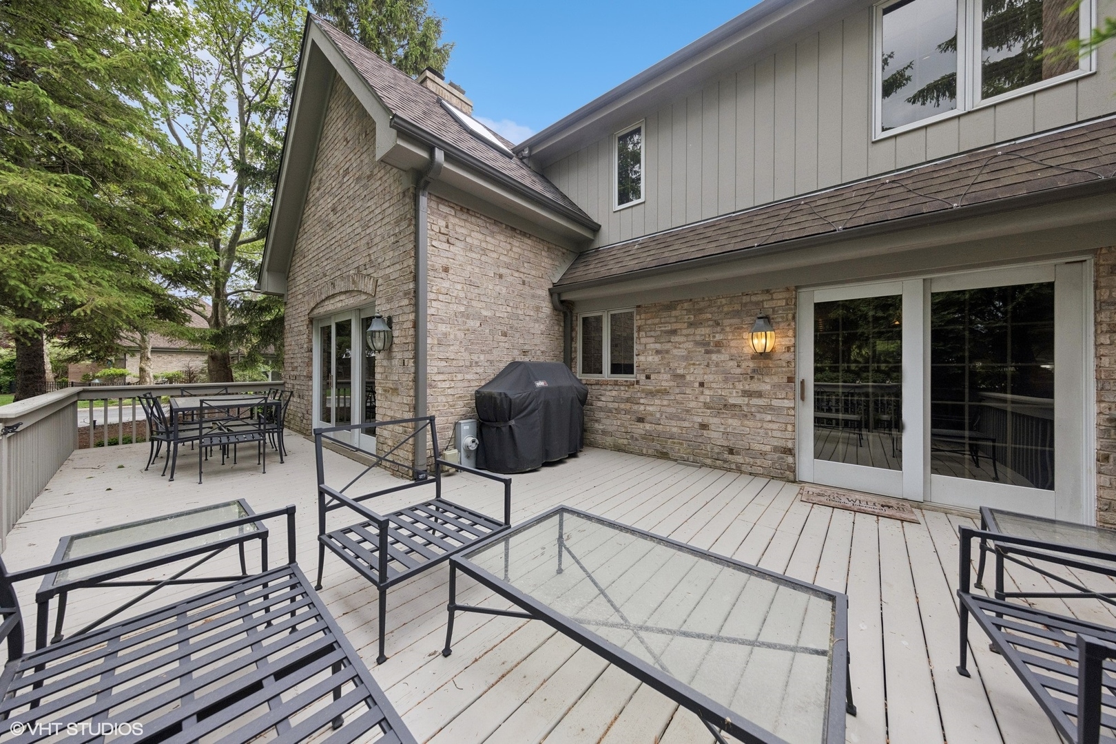 6 Tartan Ridge Road Burr Ridge, IL 60527 - Photo 37 of 41 a view of a patio with table and chairs and wooden floor