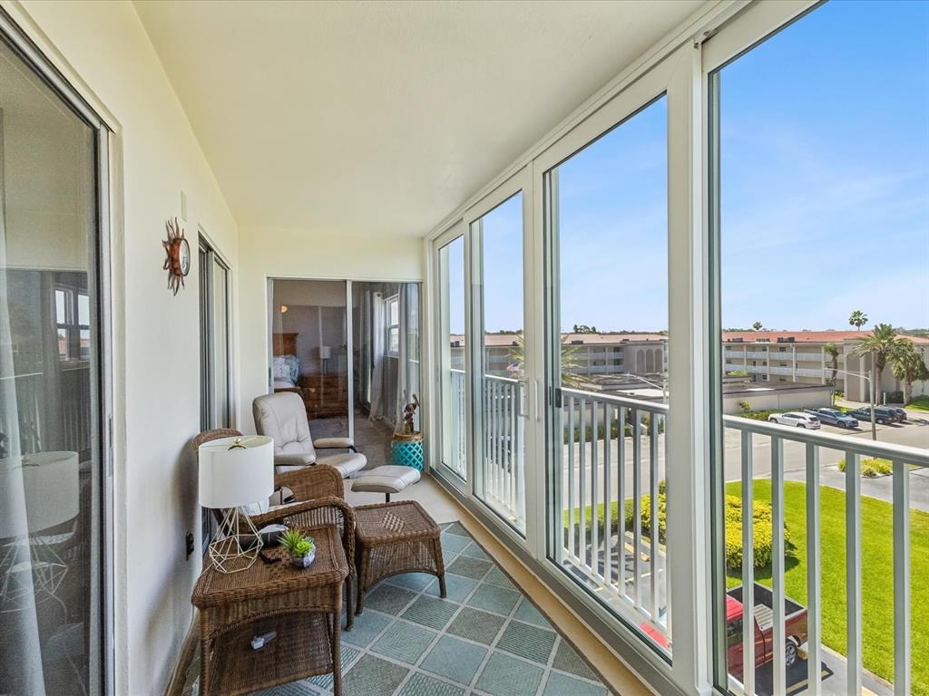 10216 Regal Drive, Unit 409 Largo, FL 33774 - Photo 21 of 42 a view of living room with furniture and floor to ceiling window