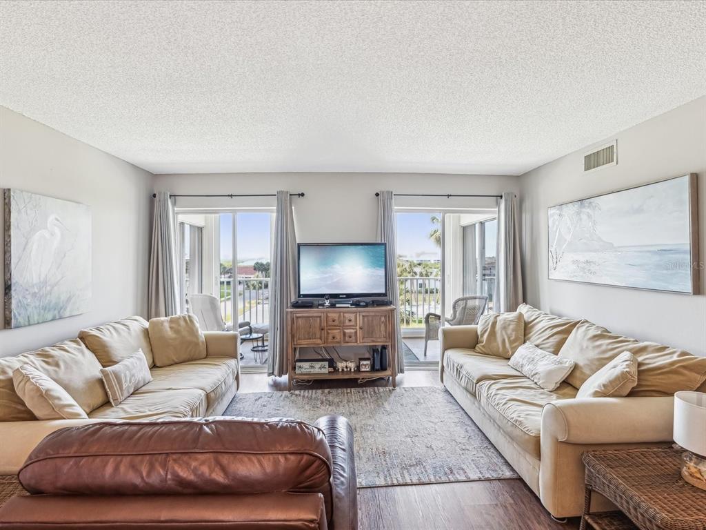 10216 Regal Drive, Unit 409 Largo, FL 33774 - Photo 4 of 42 a living room with furniture and a fireplace
