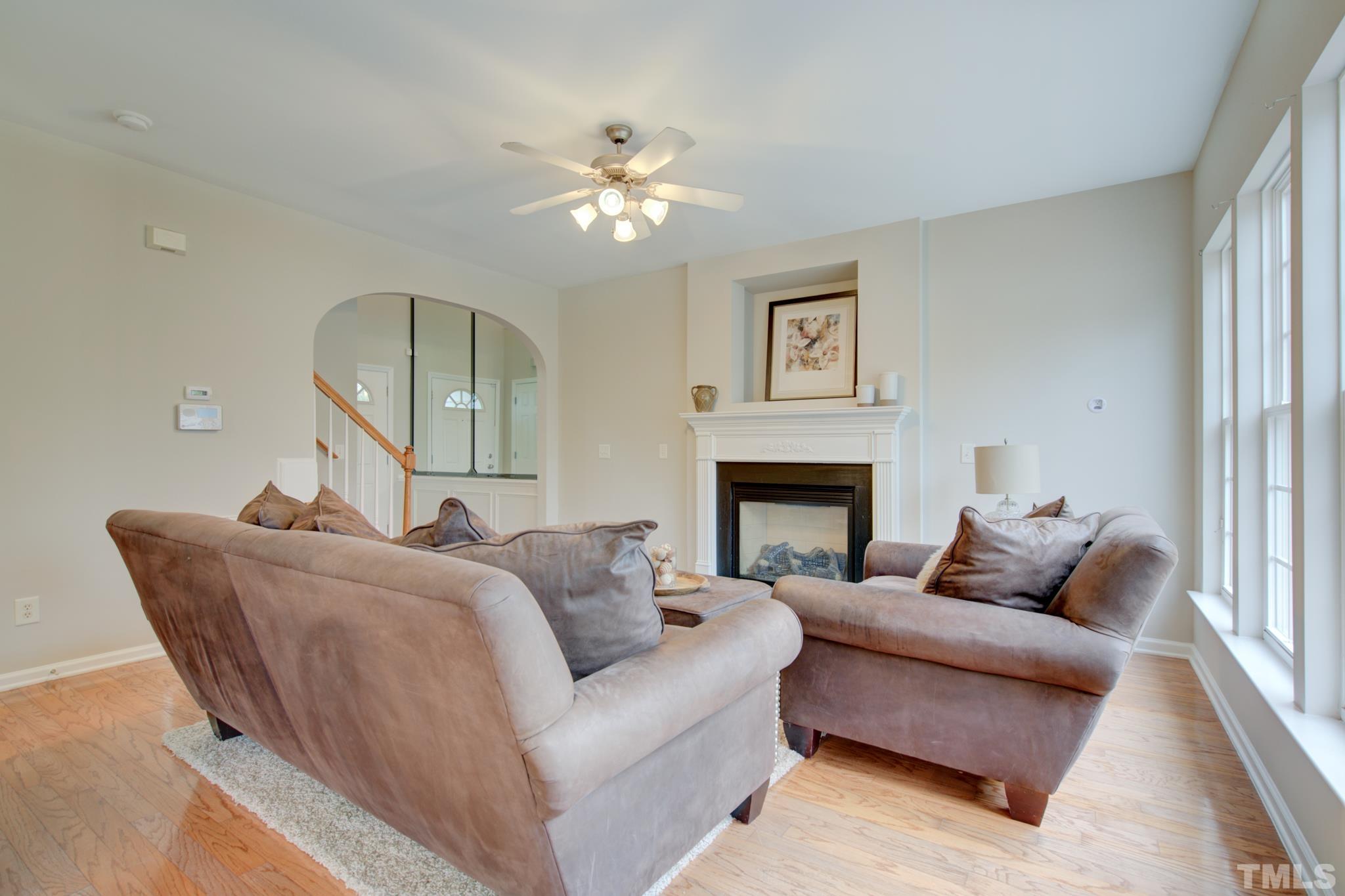 8206 Shadow Stone Court Raleigh, NC 27613 - Photo 11 of 52 a living room with furniture and a fireplace