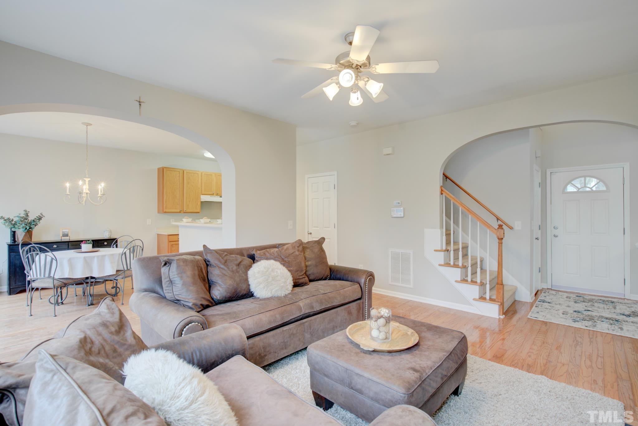 8206 Shadow Stone Court Raleigh, NC 27613 - Photo 12 of 52 a living room with furniture and a wooden floor