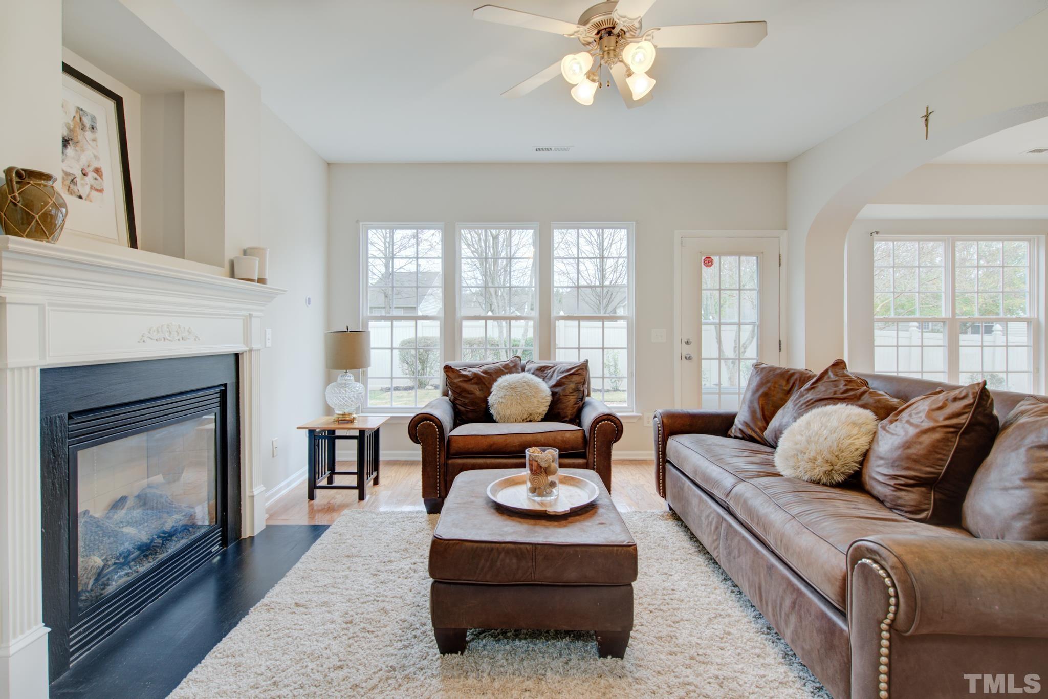 8206 Shadow Stone Court Raleigh, NC 27613 - Photo 13 of 52 a living room with furniture and a fireplace