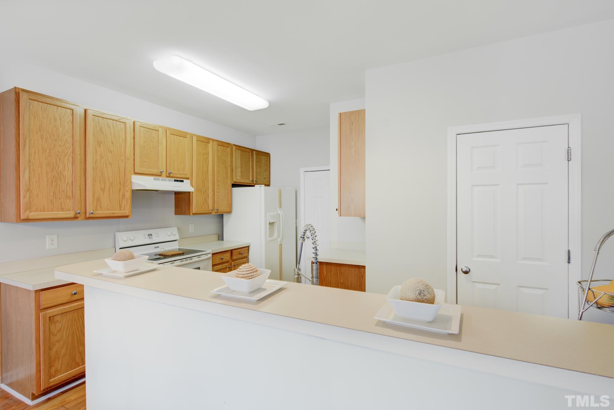 8206 Shadow Stone Court Raleigh, NC 27613 - Photo 18 of 52 a kitchen with a sink cabinets and counter space